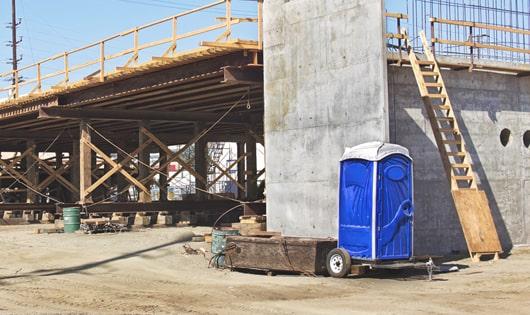 porta potties lined up for construction workers to use